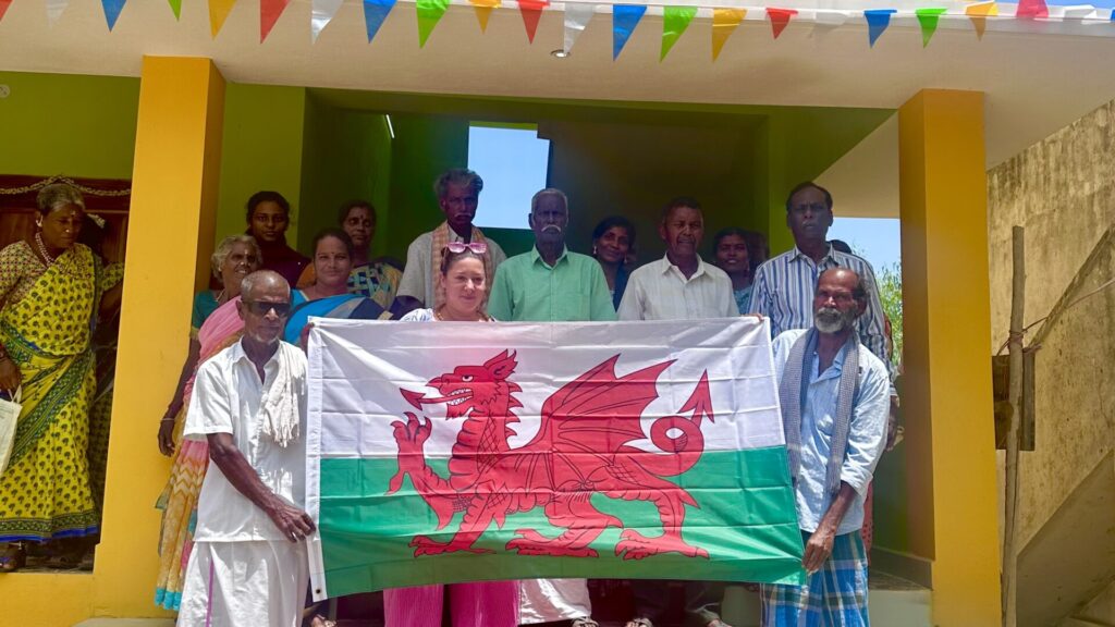 One of us Safe member and southern community people of India holding Wales flag.